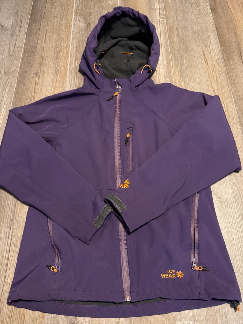 Icewear softshell jacket features high-visibility orange toggles